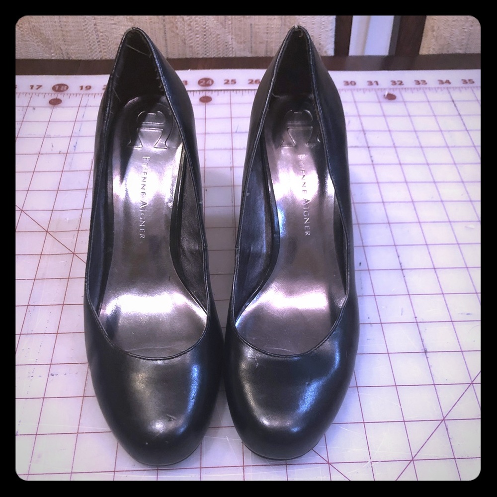 Black leather pumps
